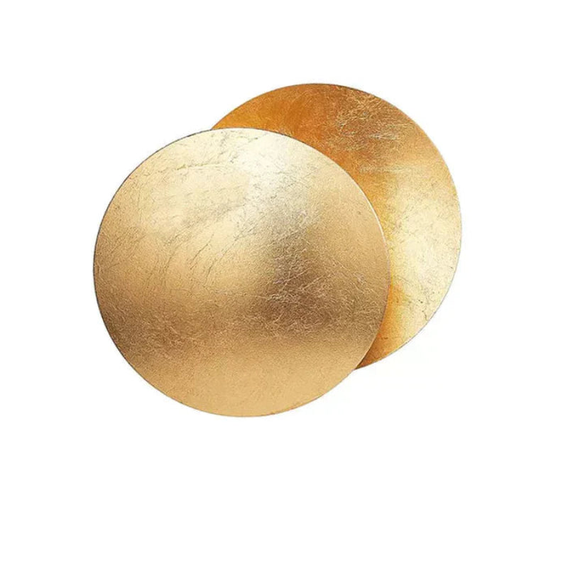 Gold eclipse-inspired LED wall light with rotating disc