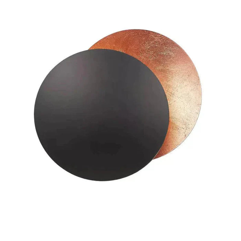 Gold eclipse-inspired LED wall light with rotating disc
