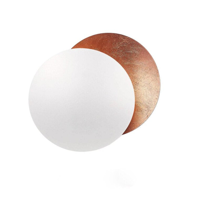 Gold eclipse-inspired LED wall light with rotating disc