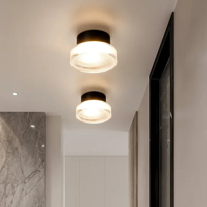 Modern circular LED wall light in black metal