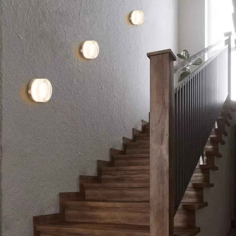 Modern circular LED wall light in black metal