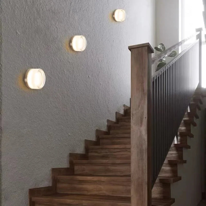 Modern circular LED wall light in black metal