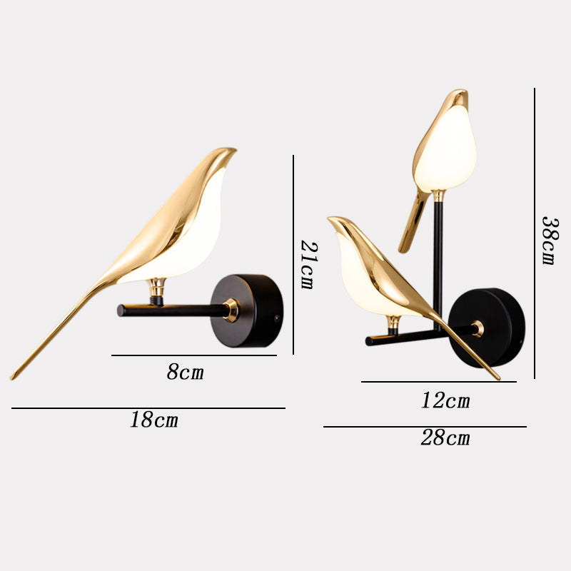Gold LED wall light with magnetic bird design