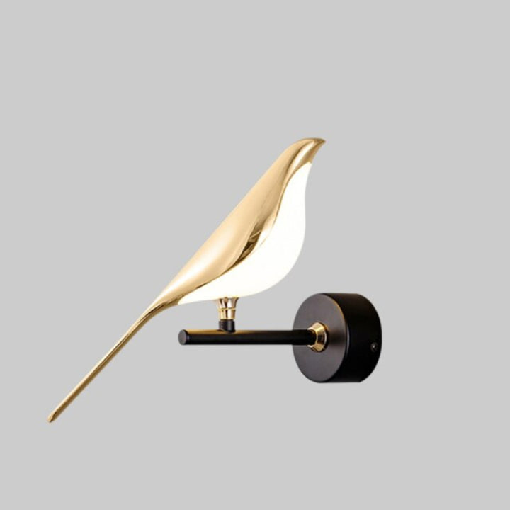 Gold LED wall light with magnetic bird design