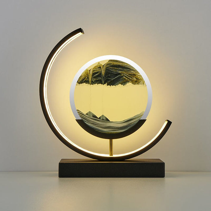 Quicksand LED table lamp with rotating sand art design
