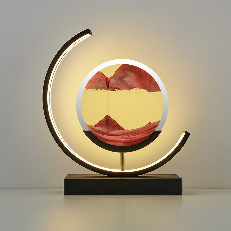 Quicksand LED table lamp with rotating sand art design