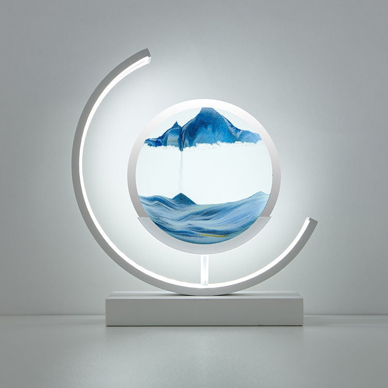 Quicksand LED table lamp with rotating sand art design