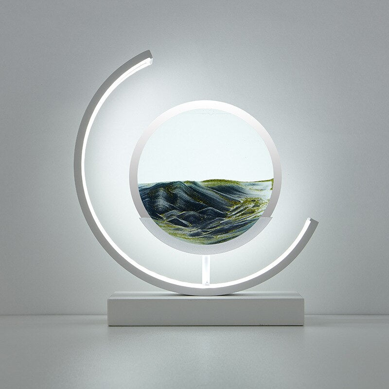 Quicksand LED table lamp with rotating sand art design
