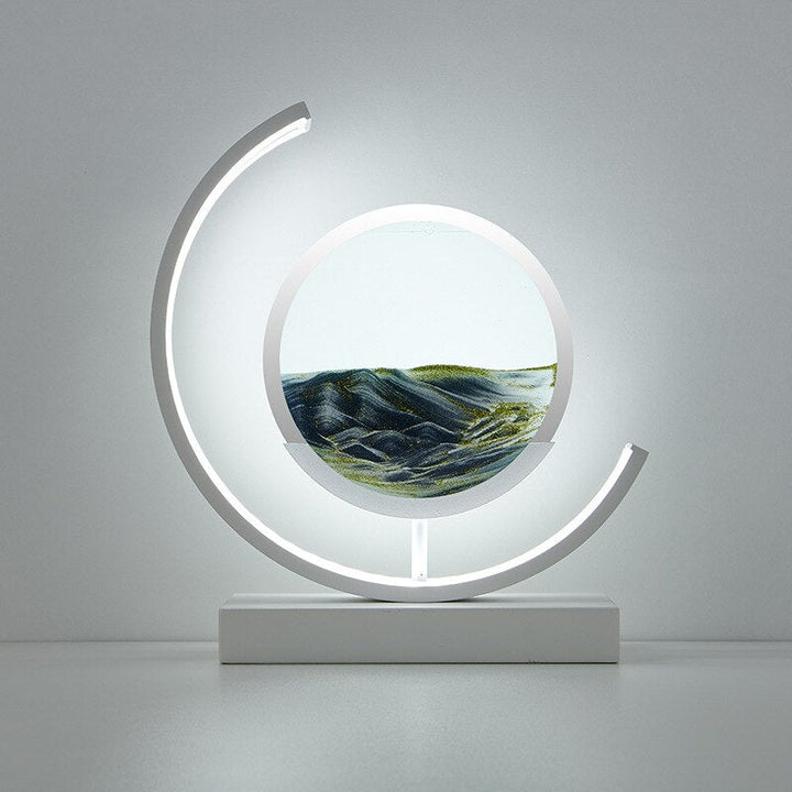 Quicksand LED table lamp with rotating sand art design