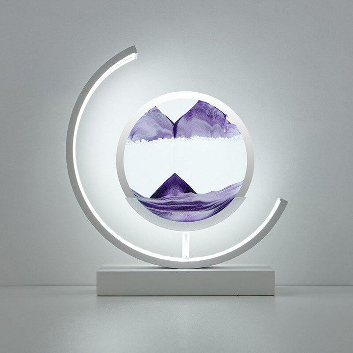 Quicksand LED table lamp with rotating sand art design