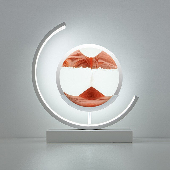Quicksand LED table lamp with rotating sand art design