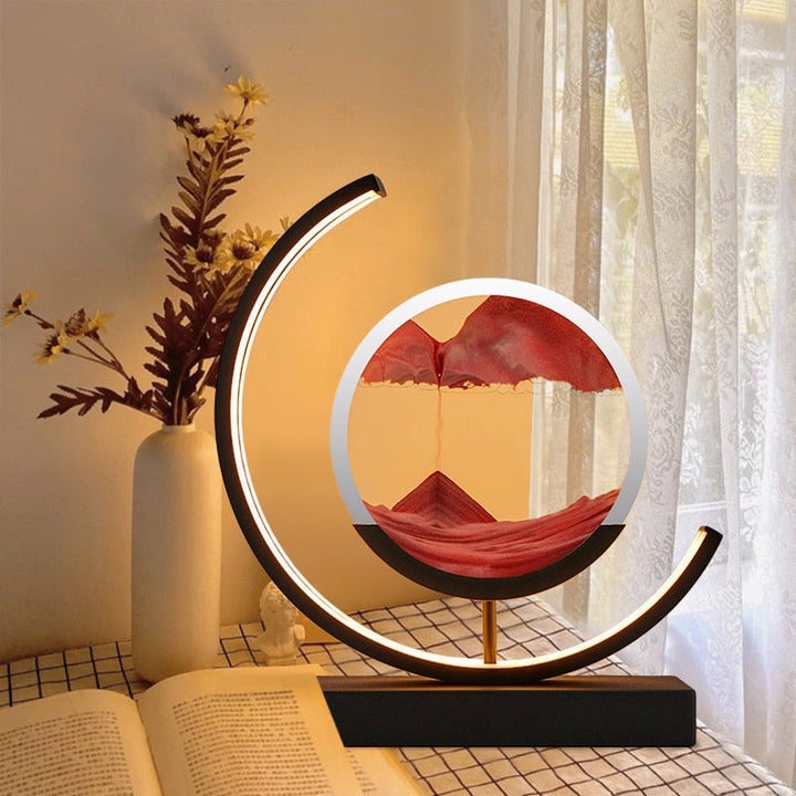 Quicksand LED table lamp with rotating sand art design