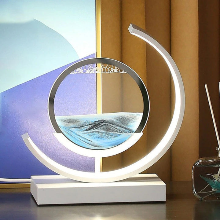 Quicksand LED table lamp with rotating sand art design