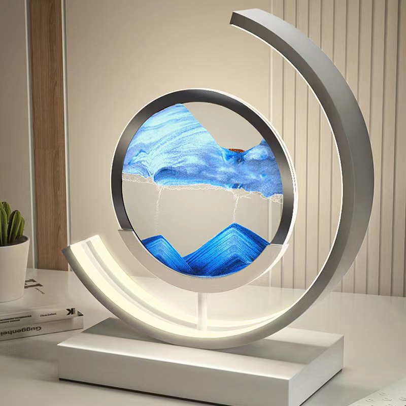 Quicksand LED table lamp with rotating sand art design
