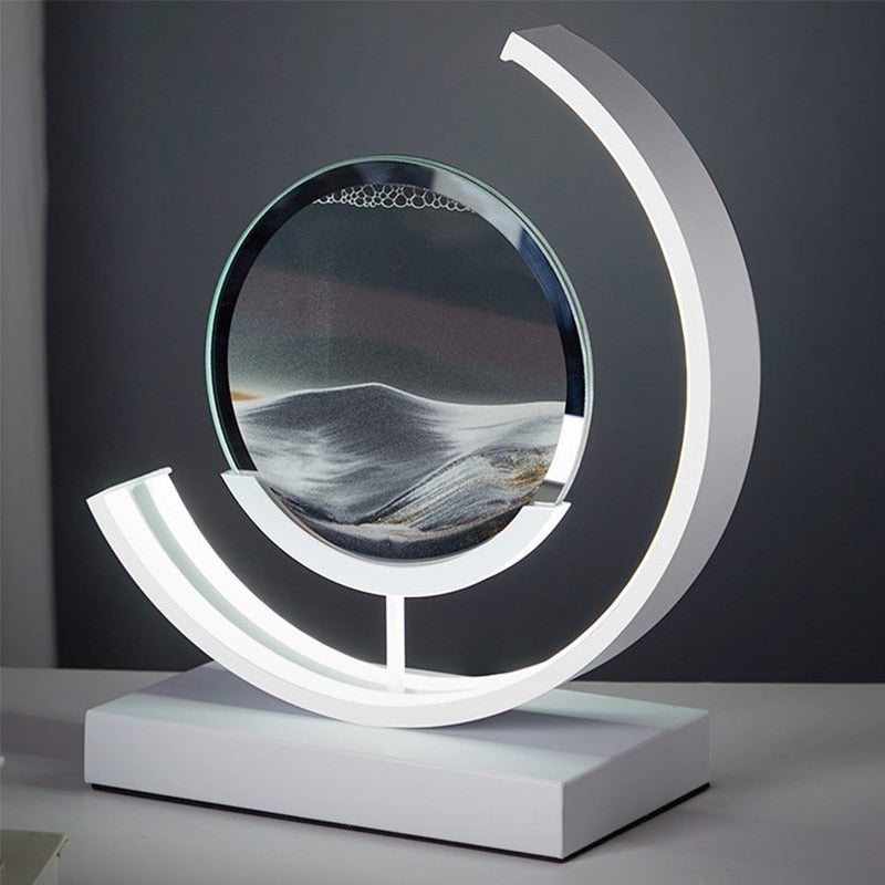 Quicksand LED table lamp with rotating sand art design