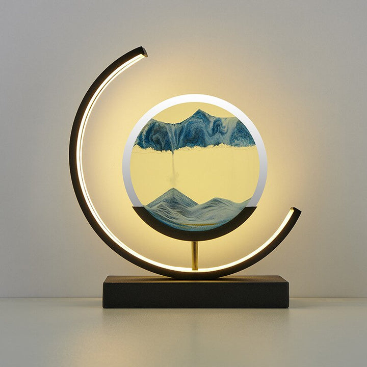 Quicksand LED table lamp with rotating sand art design