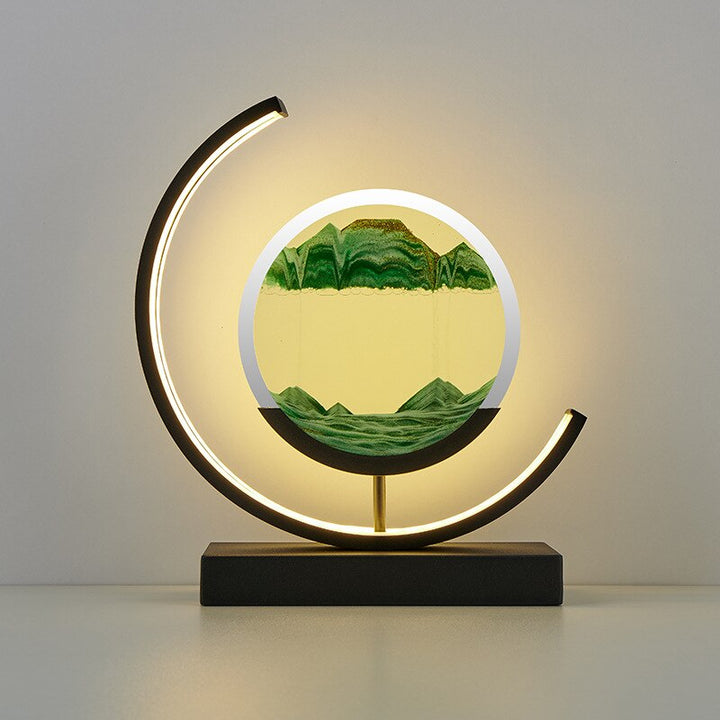 Quicksand LED table lamp with rotating sand art design