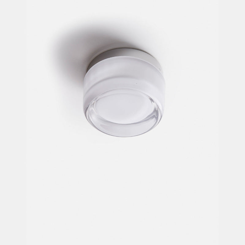 Elegant black and gold wall light with dimpled glass shade
