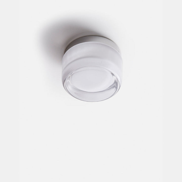 Elegant black and gold wall light with dimpled glass shade