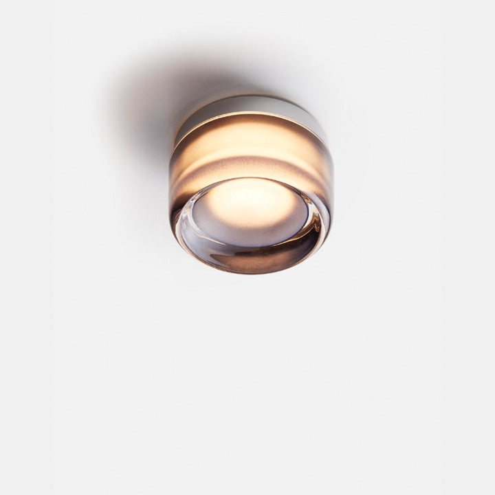 Elegant black and gold wall light with dimpled glass shade