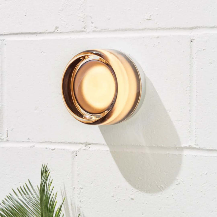 Elegant black and gold wall light with dimpled glass shade
