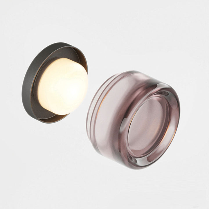 Elegant black and gold wall light with dimpled glass shade