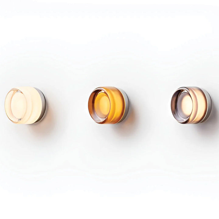 Elegant black and gold wall light with dimpled glass shade