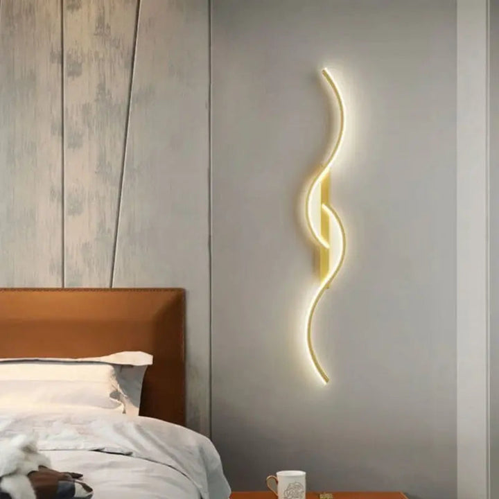 Wave-shaped dimmable LED wall light in gold and black